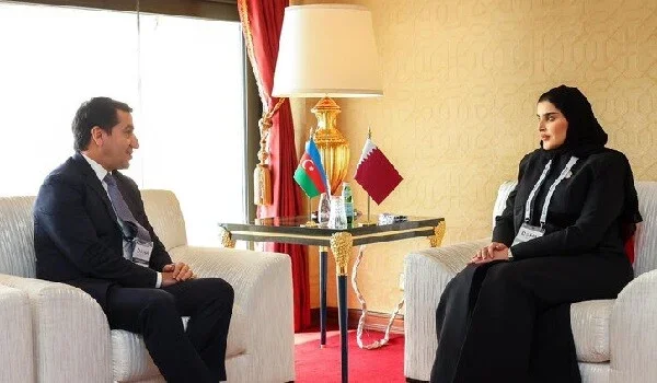 Hikmet Hajiyev meets a Qatari official in Doha